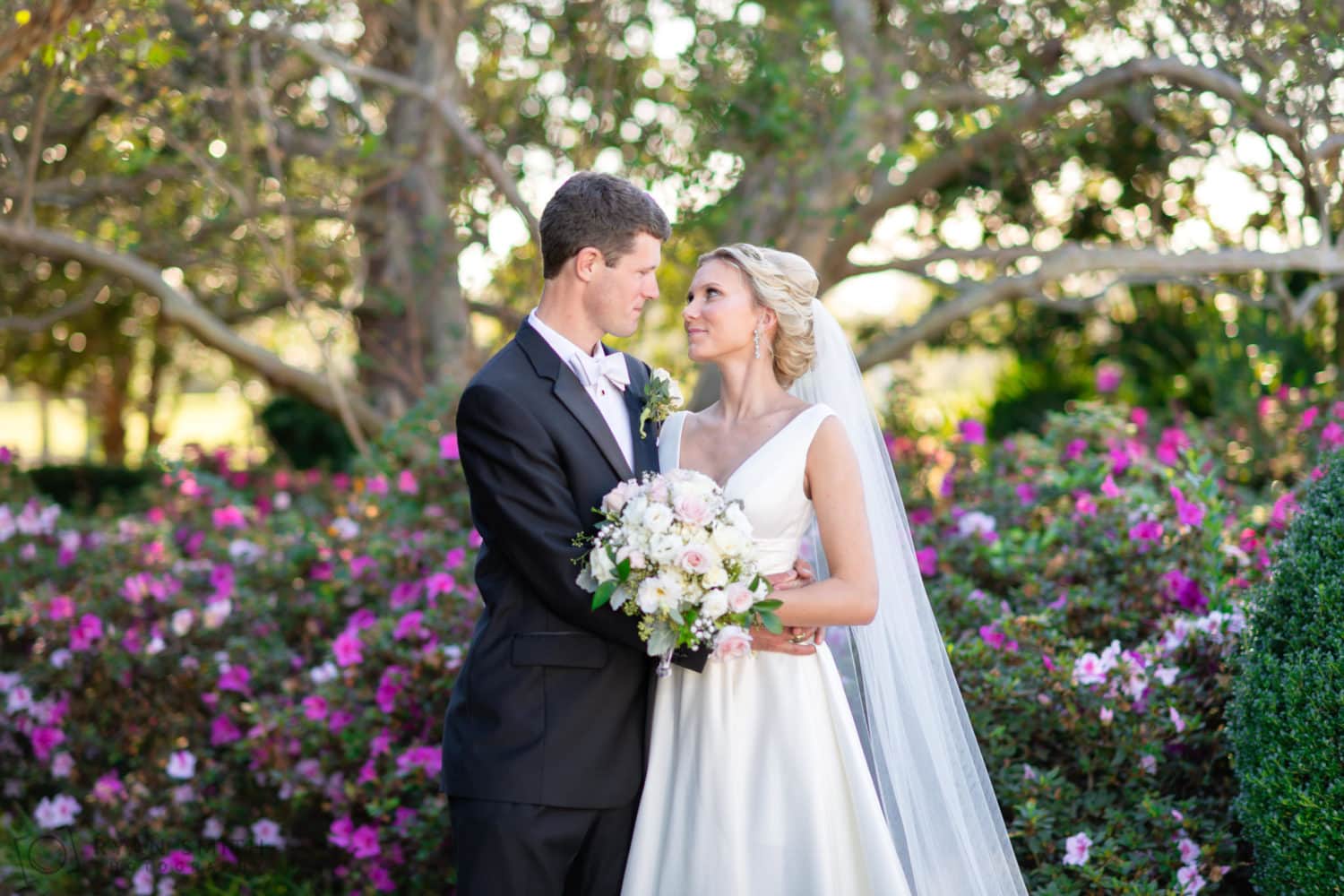 Looking into each others eyes in front of the garden trees - Pine Lakes Country Club