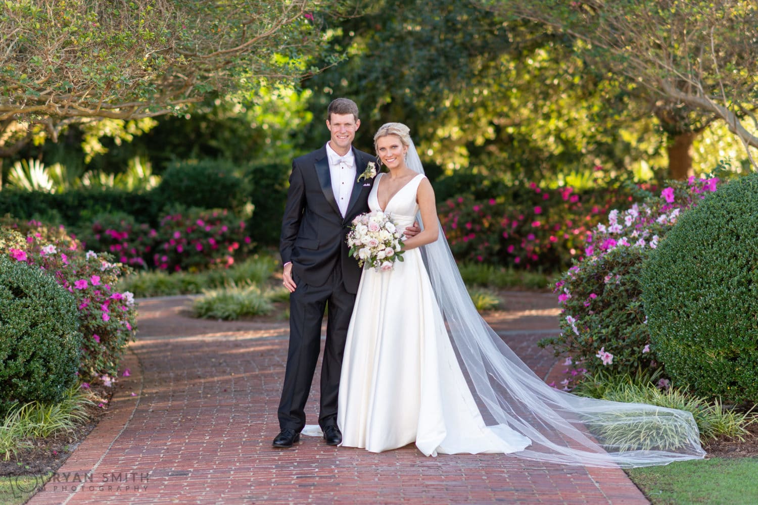 Portraits of the bride and groom on the garden path - Pine Lakes Country Club