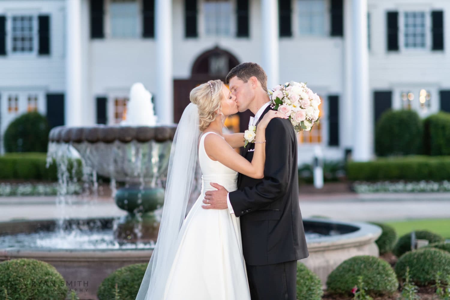 Portraits with bride and groom in front of the fountain - Pine Lakes Country Club