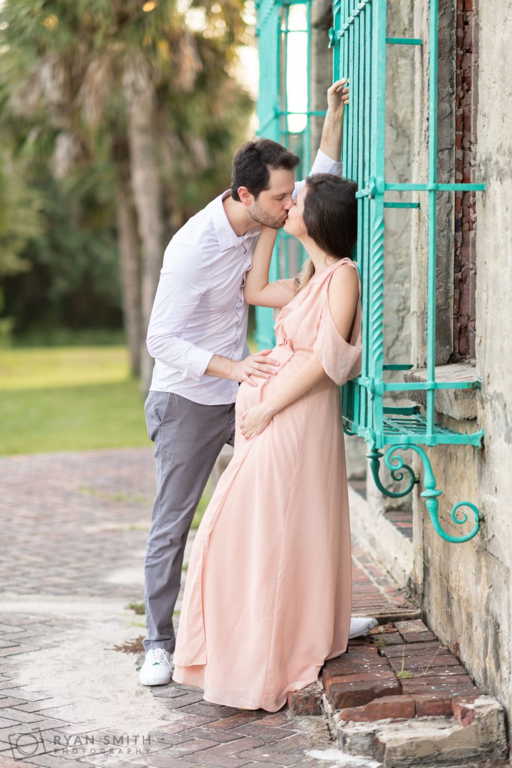 Couple looking at expectant mother's belly - Atalaya Castle