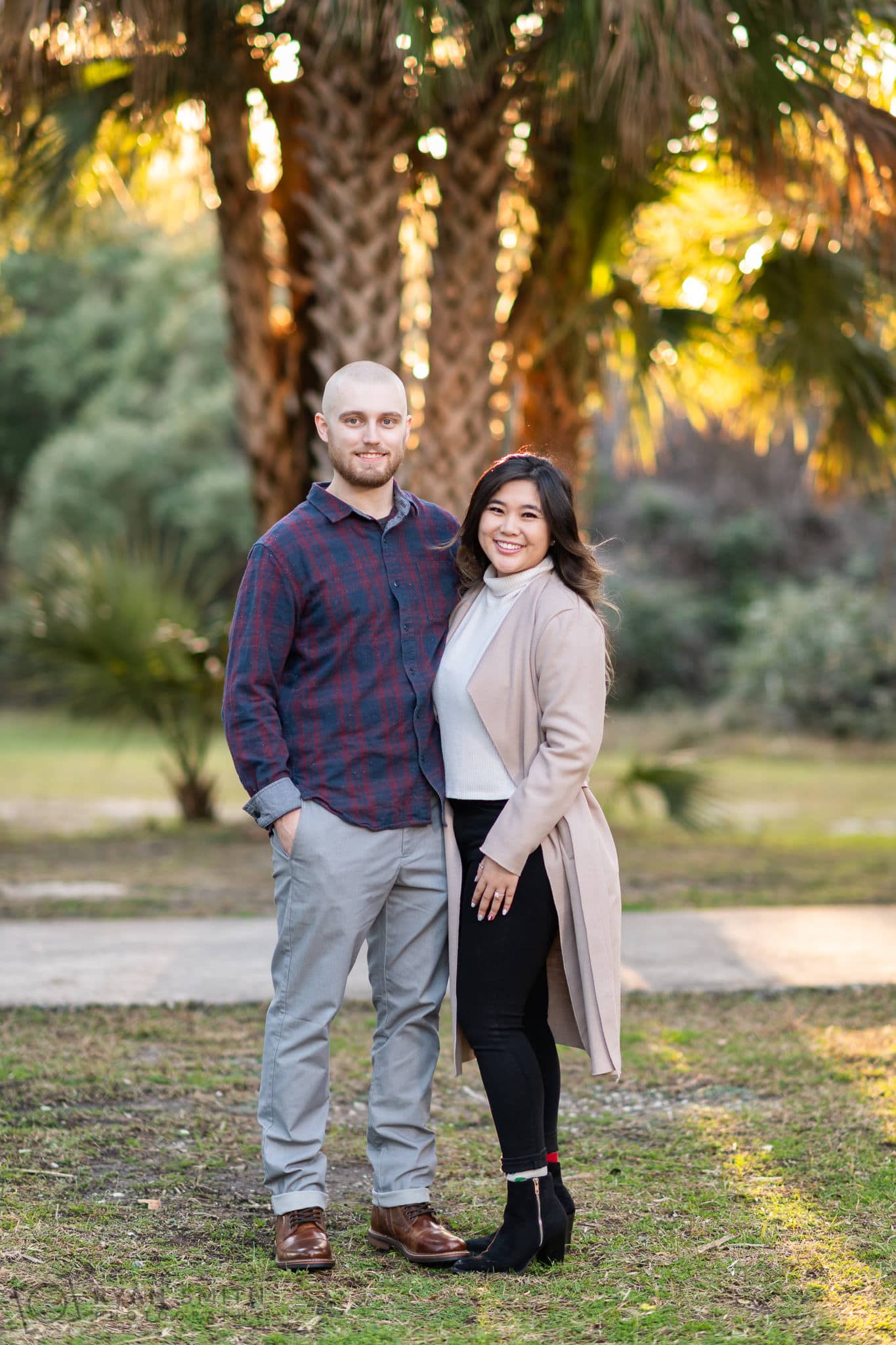 Couple posing in front of the palms - Huntington Beach State Park