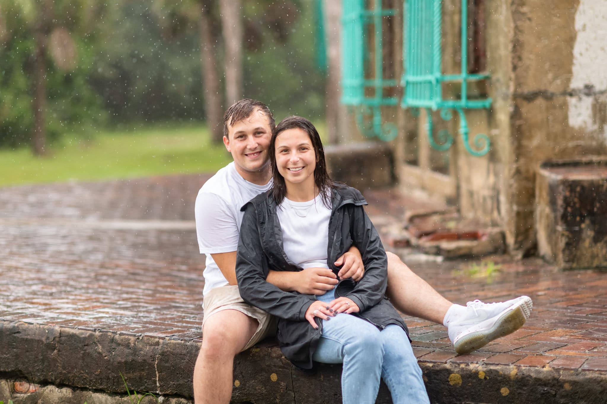 Engagement pictures in the pouring rain with their dog  - Huntington Beach State Park