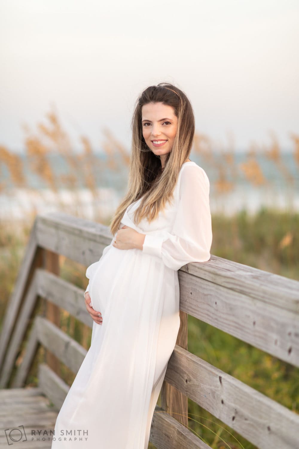 Expectant mother portraits on the beach walkway - Huntington Beach State Park