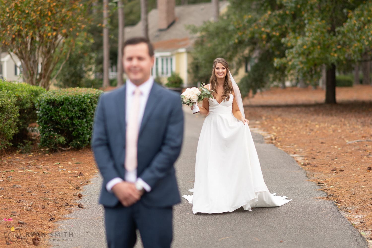 First look with bride and groom behind their cottage on the golf course - Wachesaw Plantation