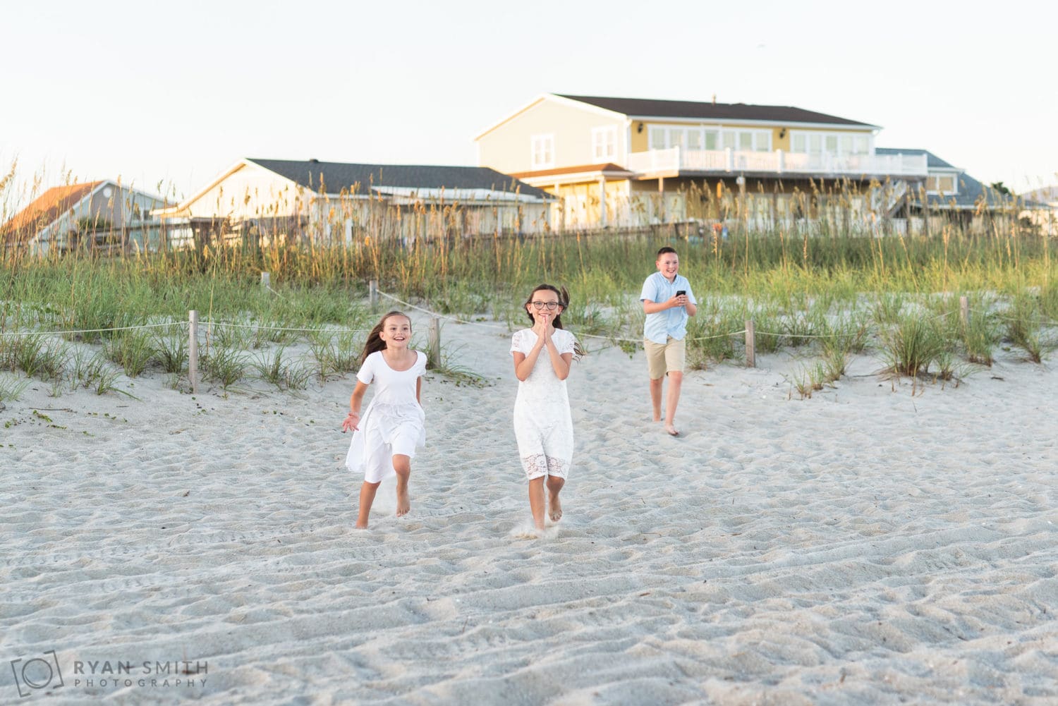 Kids running towards mom and dad after proposal - Holden Beach, NC