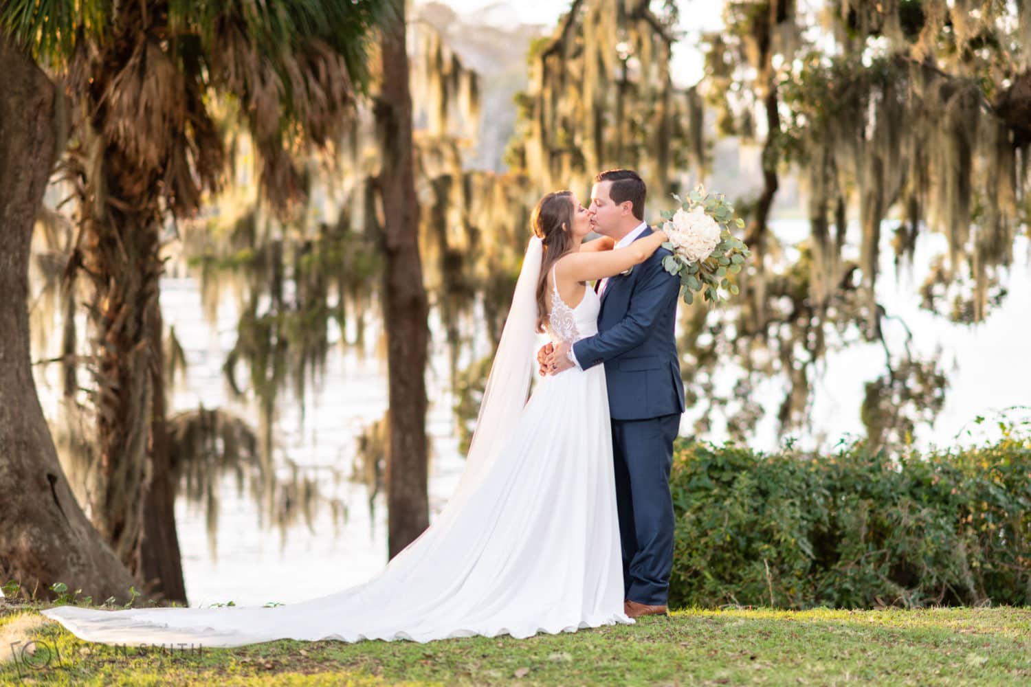 Kiss in front of the beautiful light hitting the moss - Kimbel's - Wachesaw Plantation