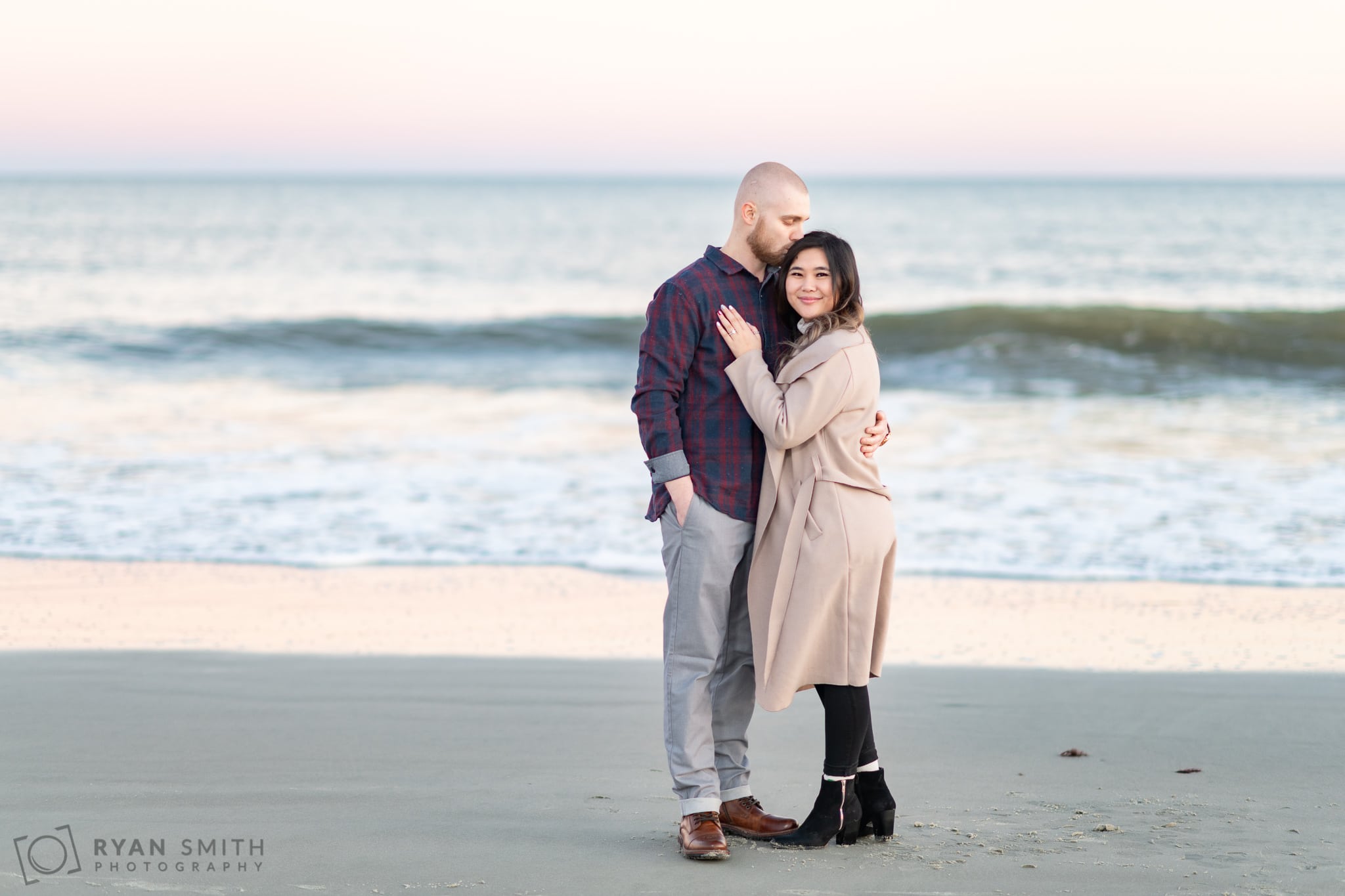 Kiss on the head in front of the ocean - Huntington Beach State Park