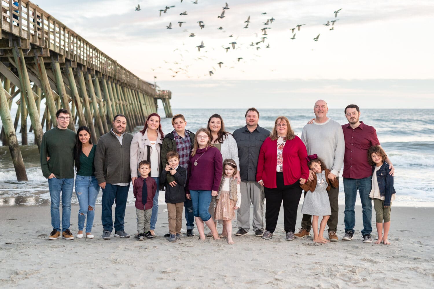 Large family by the pier with seagulls in the background - Myrtle Beach State Park