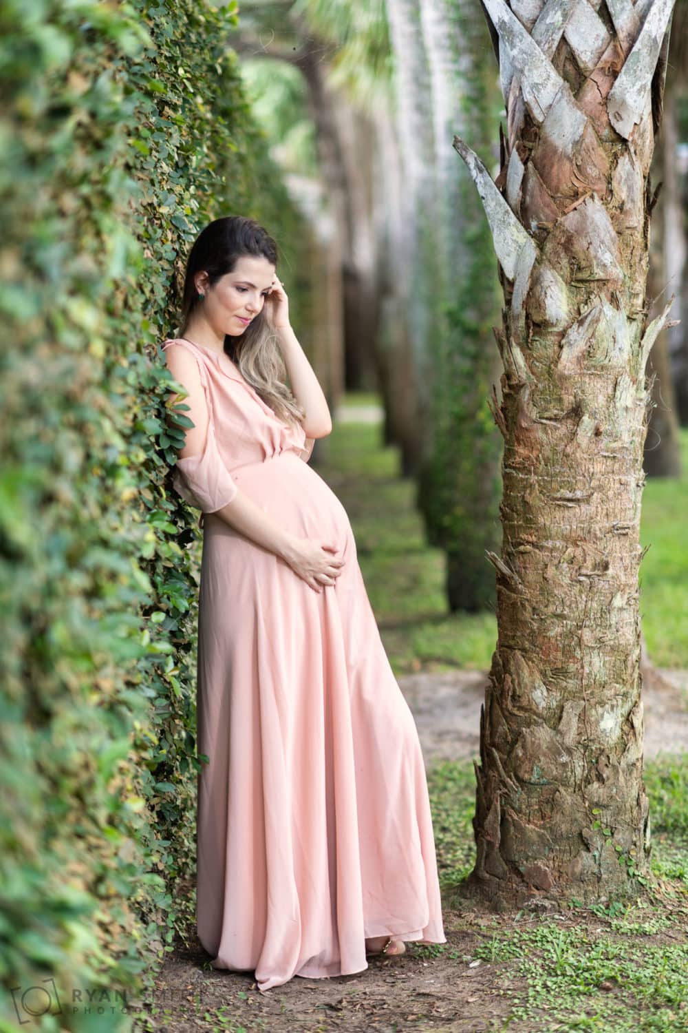 Maternity portraits leaning against the ivy wall - Atalaya Castle