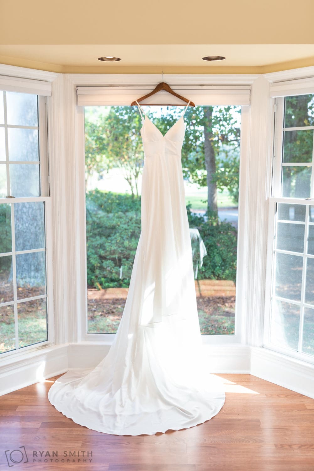 Wedding dress handing in the window - Wachesaw Plantation
