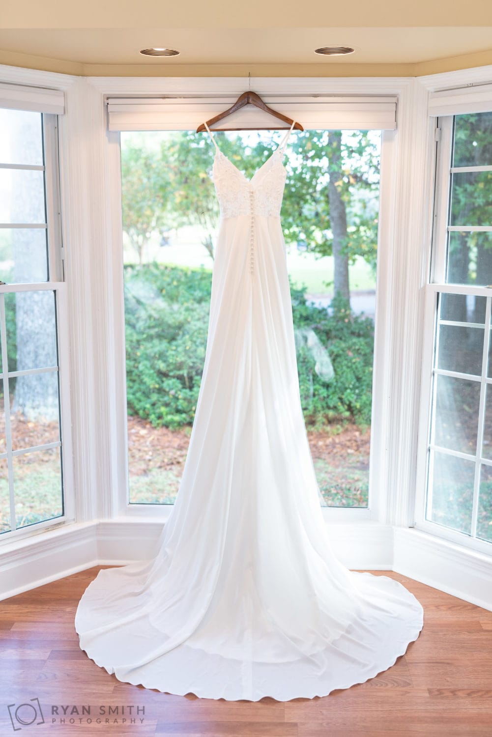 Wedding dress handing in the window - Wachesaw Plantation