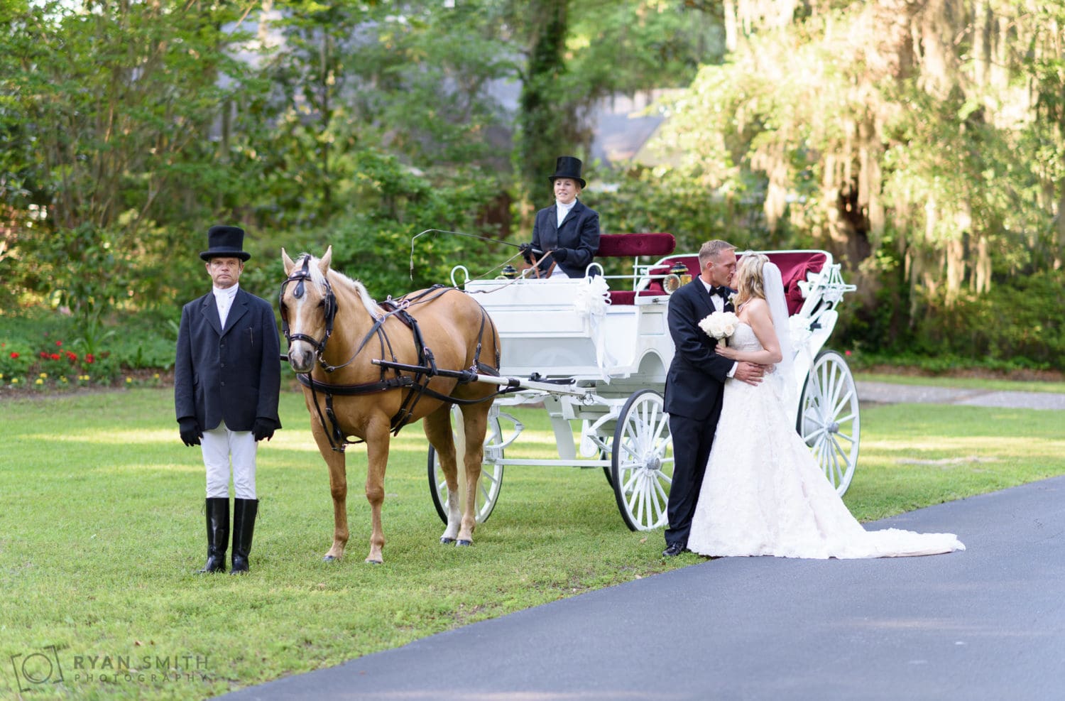 Bride and groom with horse drawn carriage  - Wachesaw Plantation