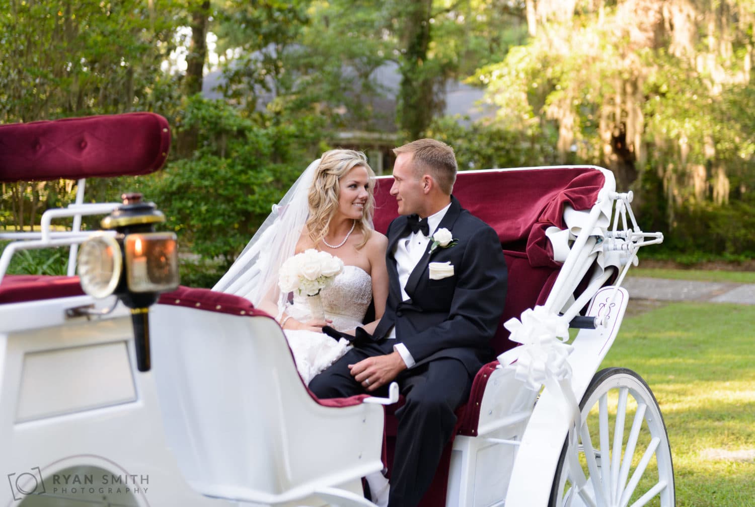 Bride and groom with horse drawn carriage  - Wachesaw Plantation