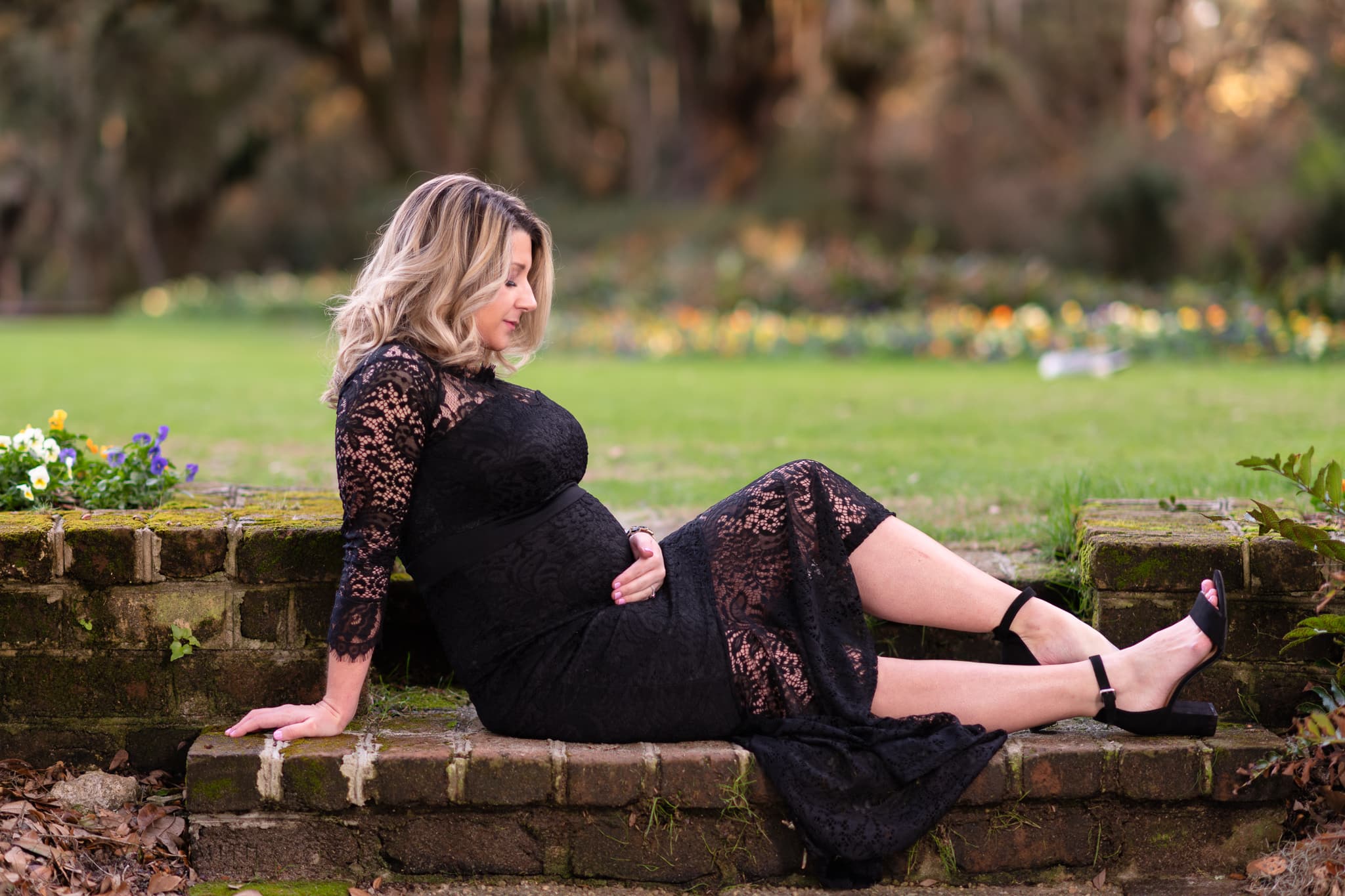 Pregnancy portrait sitting on steps looking at belly - Caledonia Golf & Fish Club