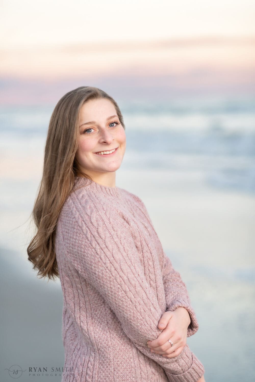 Senior portrait in front of the ocean at sunset - Huntington Beach State Park