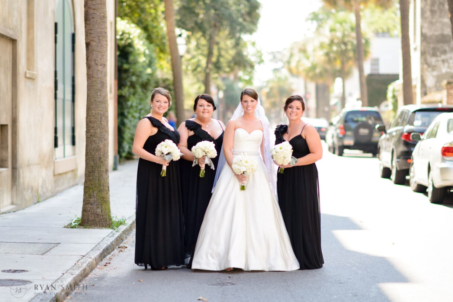 Bride and bridesmaids standing in the street - Downtown Charleston, SC