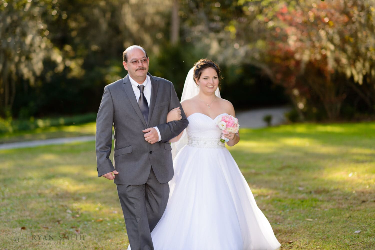 Bride and father walking to the ceremony - Magnolia Plantation