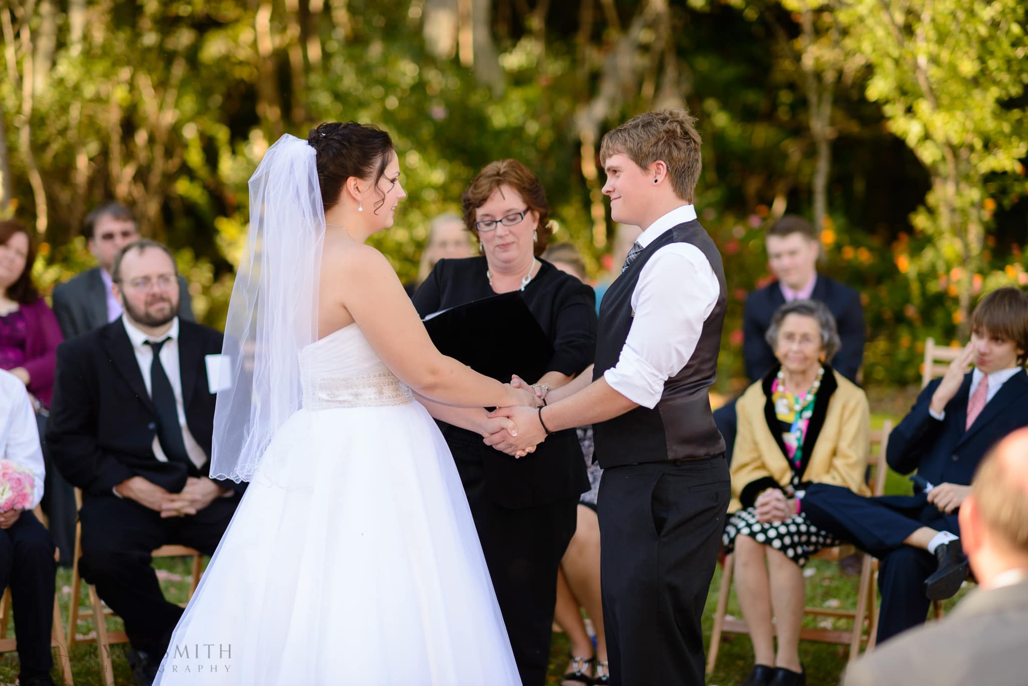 Bride and groom holding hands - Magnolia Plantation