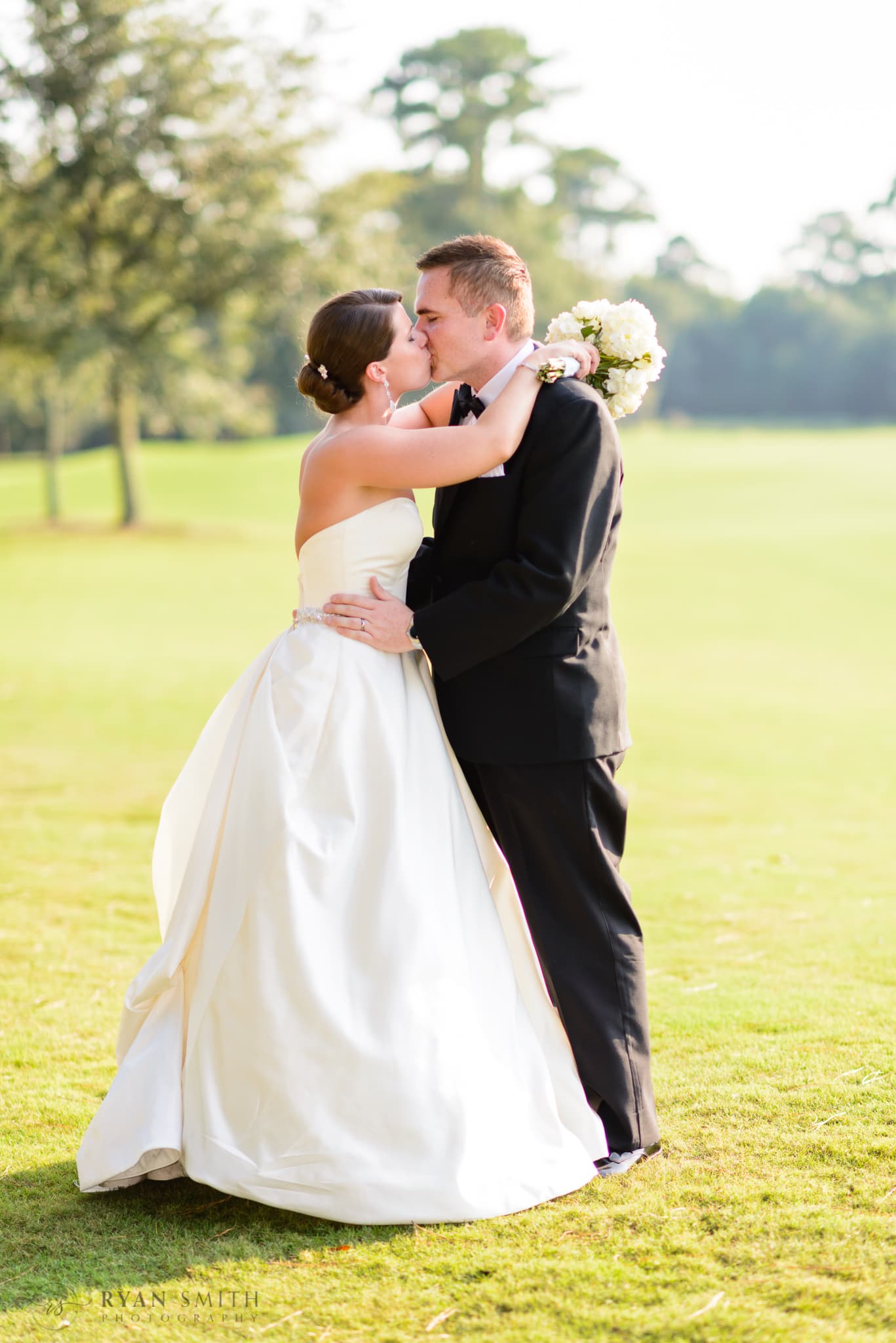 Bride and groom on the golf course - Daniel Island Club - Charleston, SC