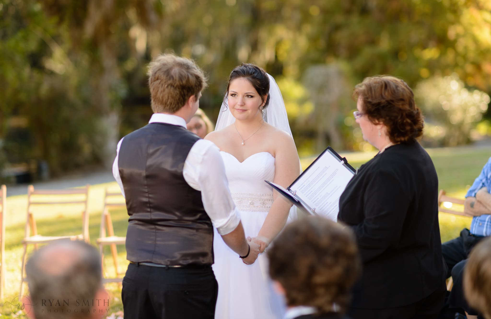 Bride looking at the groom during the ceremony - Magnolia Plantation