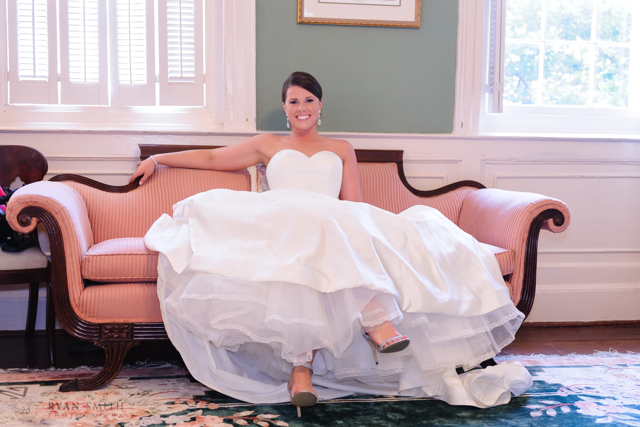 Bride sitting on the couch - Downtown Charleston, SC
