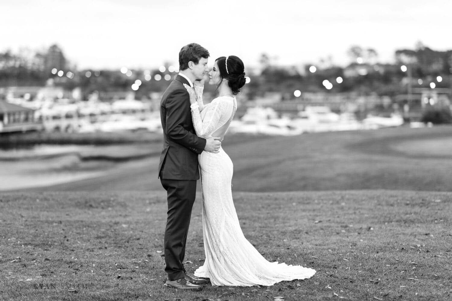 Bride touching groom's face in black and white - Grande Dunes - Myrtle Beach