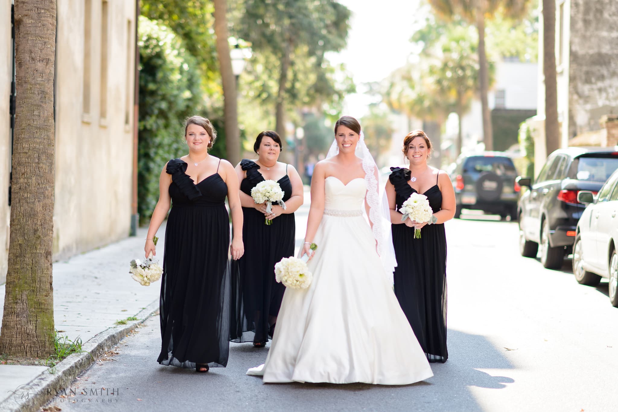 Bride walking down the downtown street with bridesmaids  - Charleston, SC