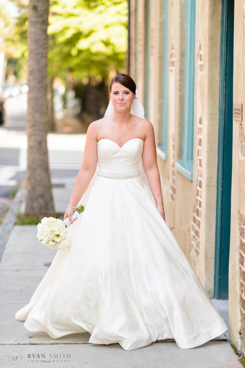 Bride walking down the sidewalk - Downtown Charleston, SC