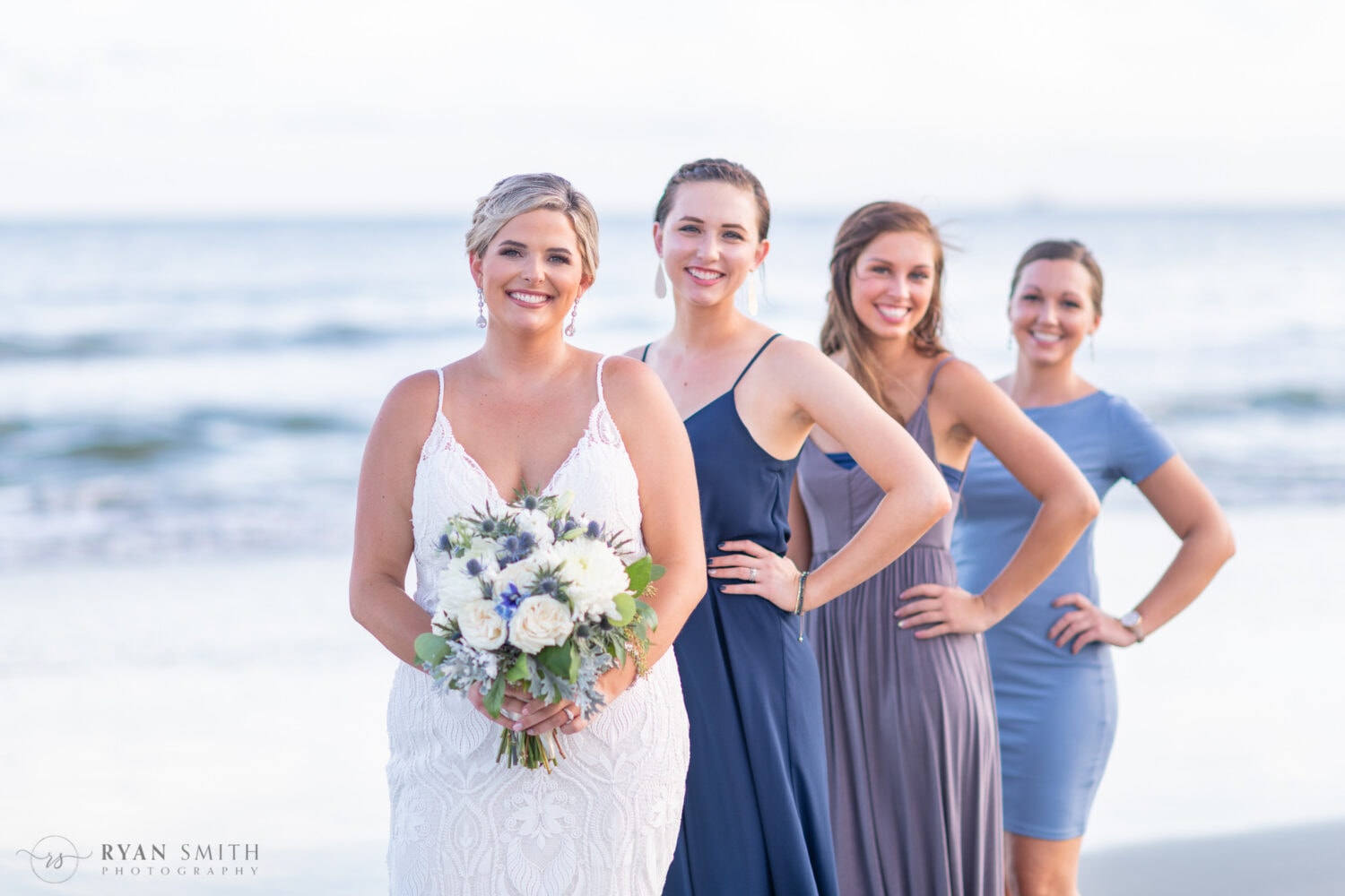 Bride with the girls out of focus behind her - Folly Beach - Charleston