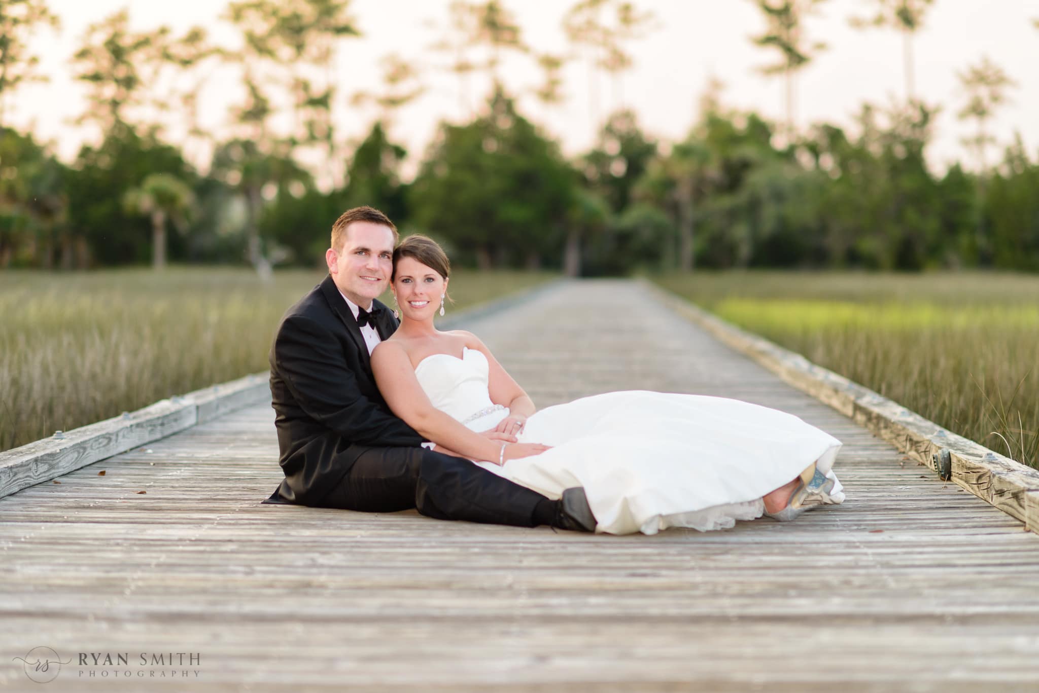 Couple laying together on the boardwalk - Daniel Island Club - Charleston, SC