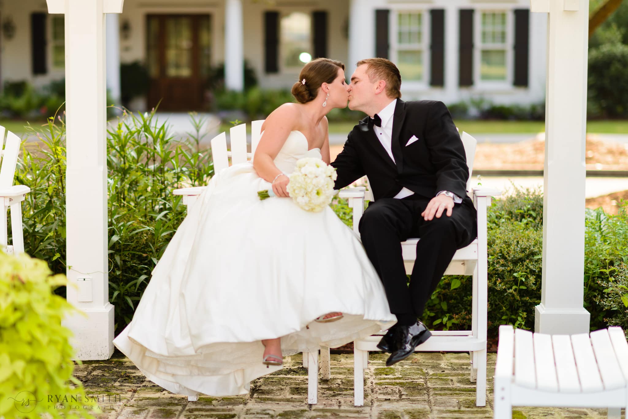 Couple sitting together in the courtyard - Daniel Island Club - Charleston, SC