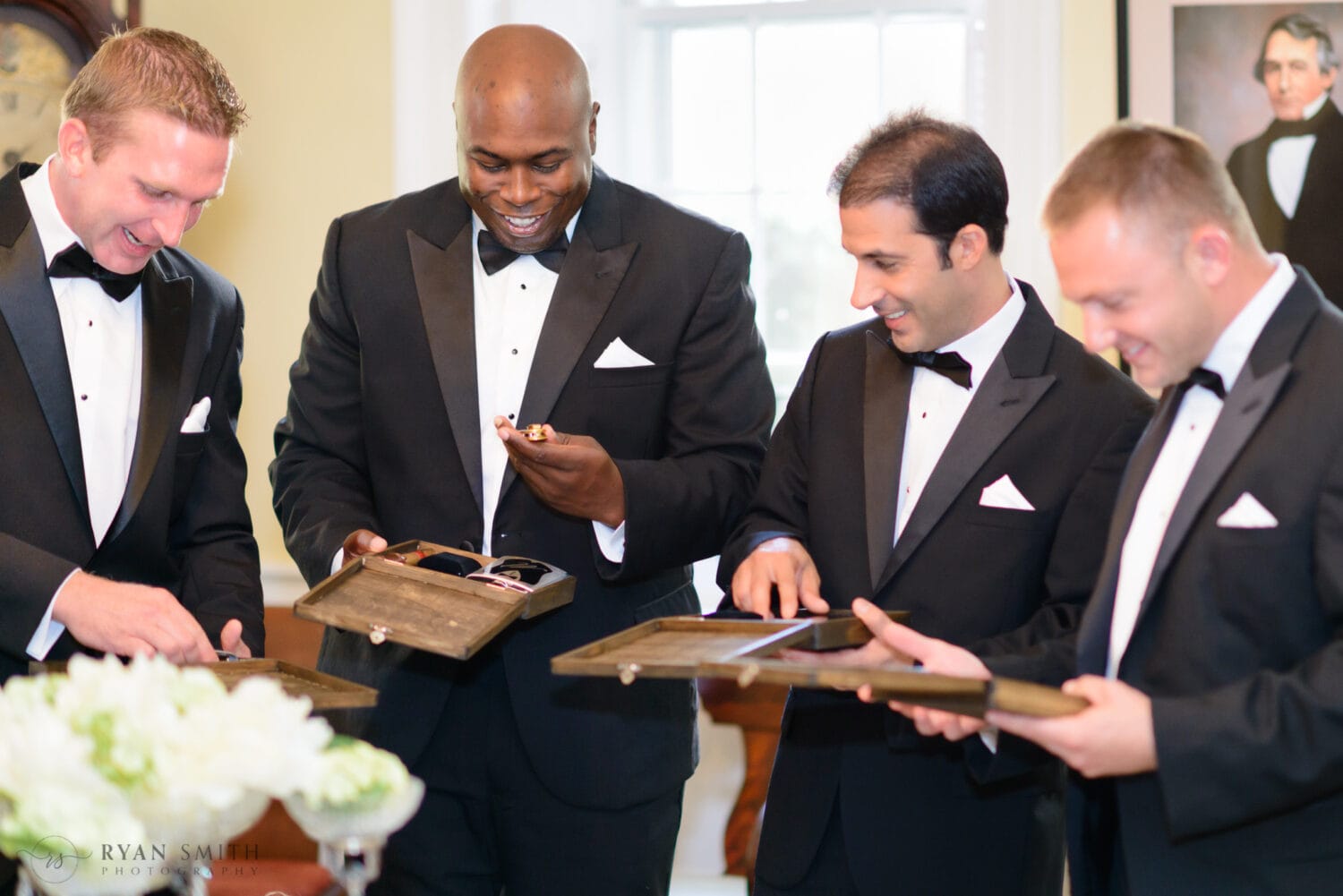 Groomsmen getting their gifts from the groom - Downtown Charleston, SC