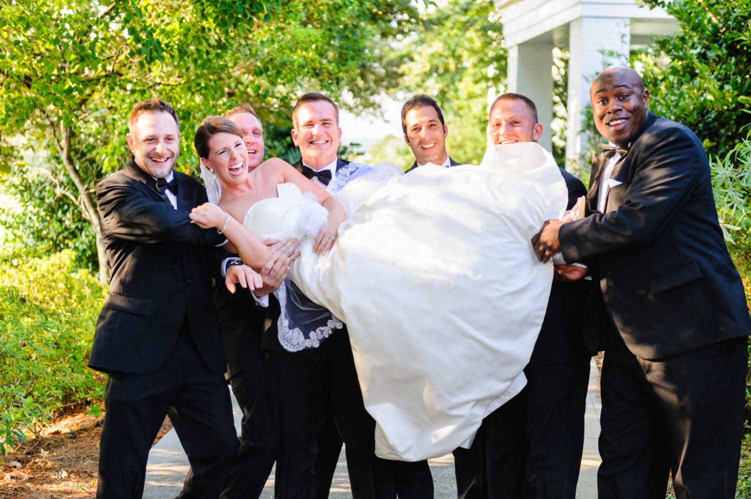 Groomsmen trying to pick up the bride - Daniel Island Club - Charleston, SC