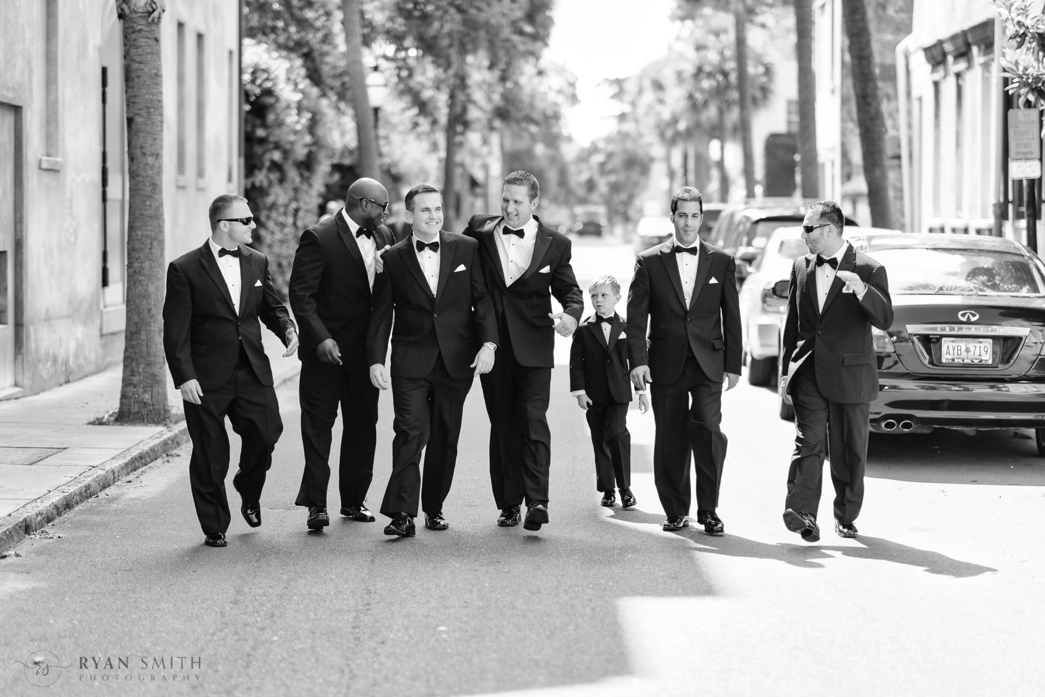 Groomsmen walking down the street together  - Charleston, SC
