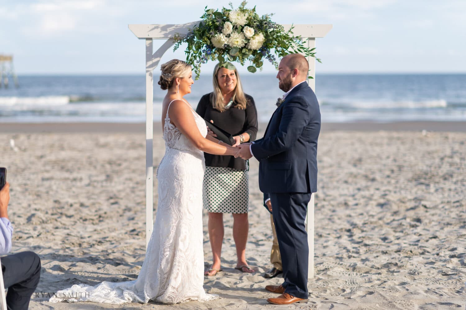 Holding hands during the ceremony - Folly Beach - Charleston