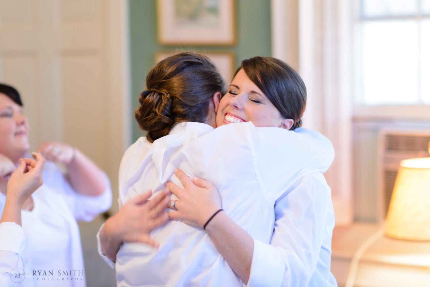Hug from the bridesmaid - Downtown Charleston, SC