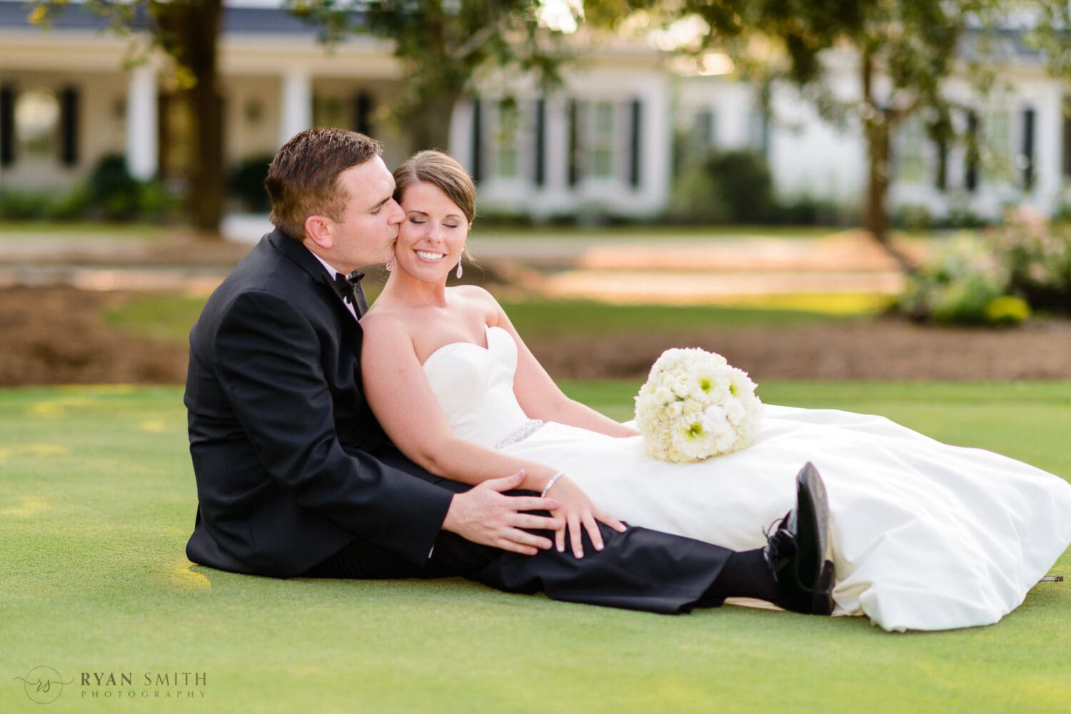 Kiss on the cheek in front of the clubhouse - Daniel Island Club - Charleston, SC