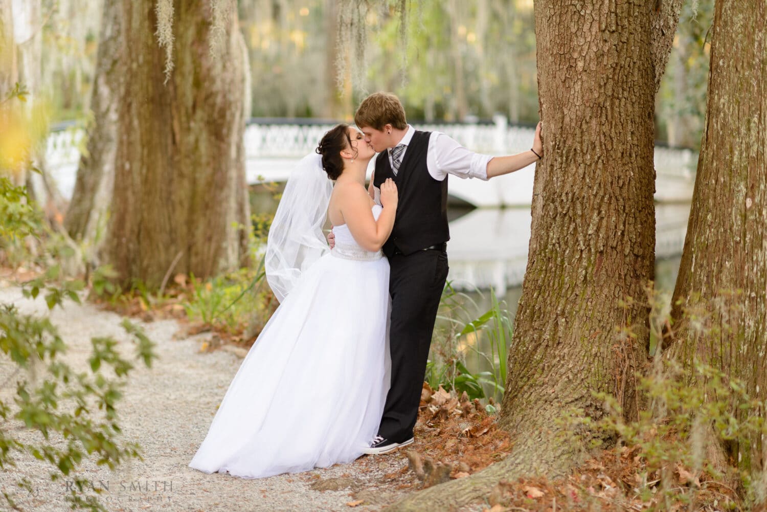 KIss with the white bridge in the background - Magnolia Plantation