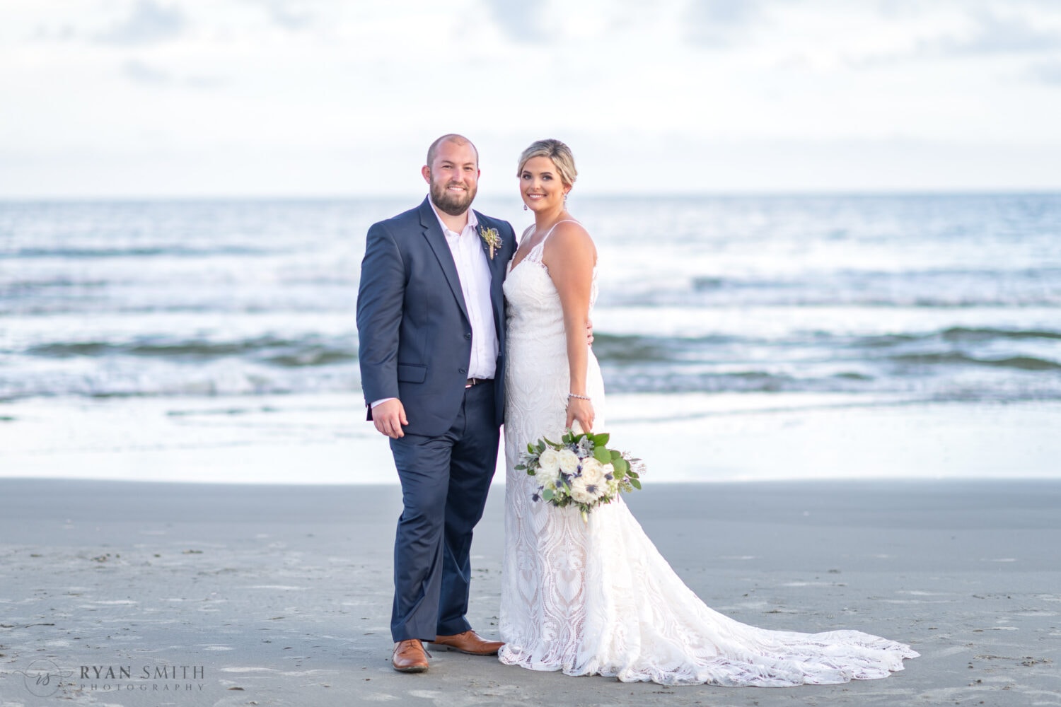 Portrait with the flowers hanging down by the bride's side - Folly Beach - Charleston