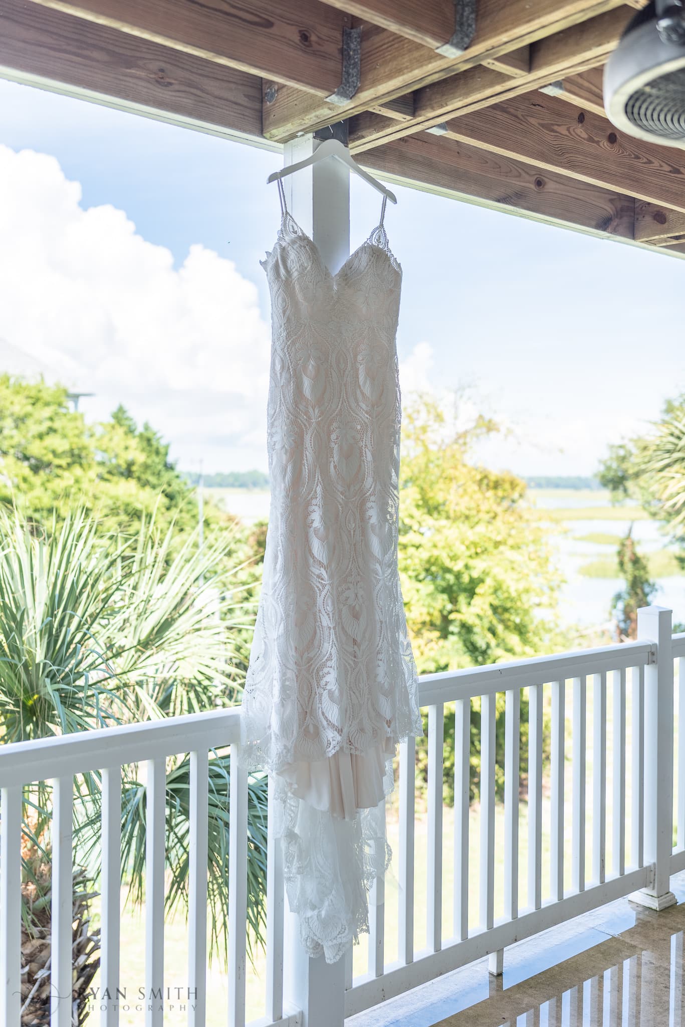 Wedding dress hanging by the marsh - Folly Beach - Charleston