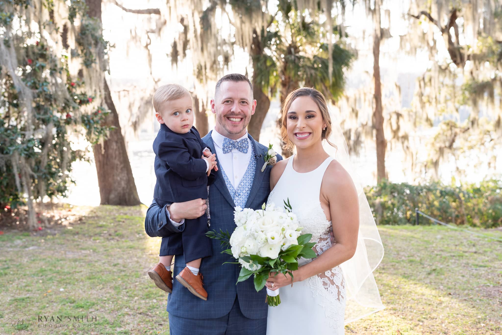 Bride and groom with their son  - Kimbels at Wachesaw Plantation