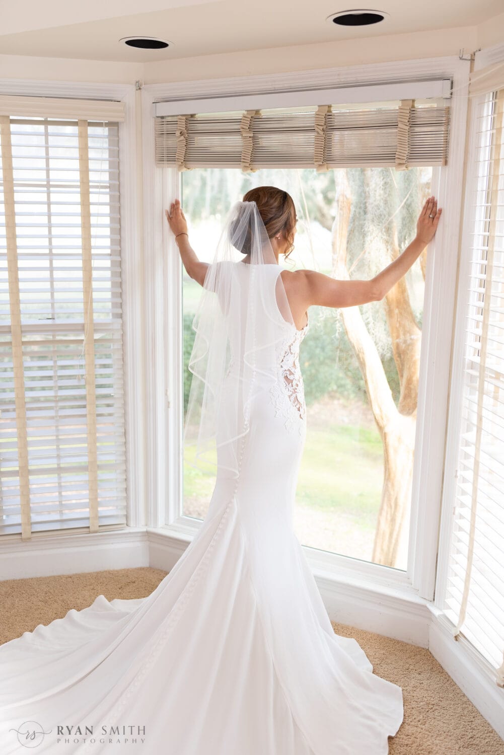 Bride looking out the window - Kimbels at Wachesaw Plantation