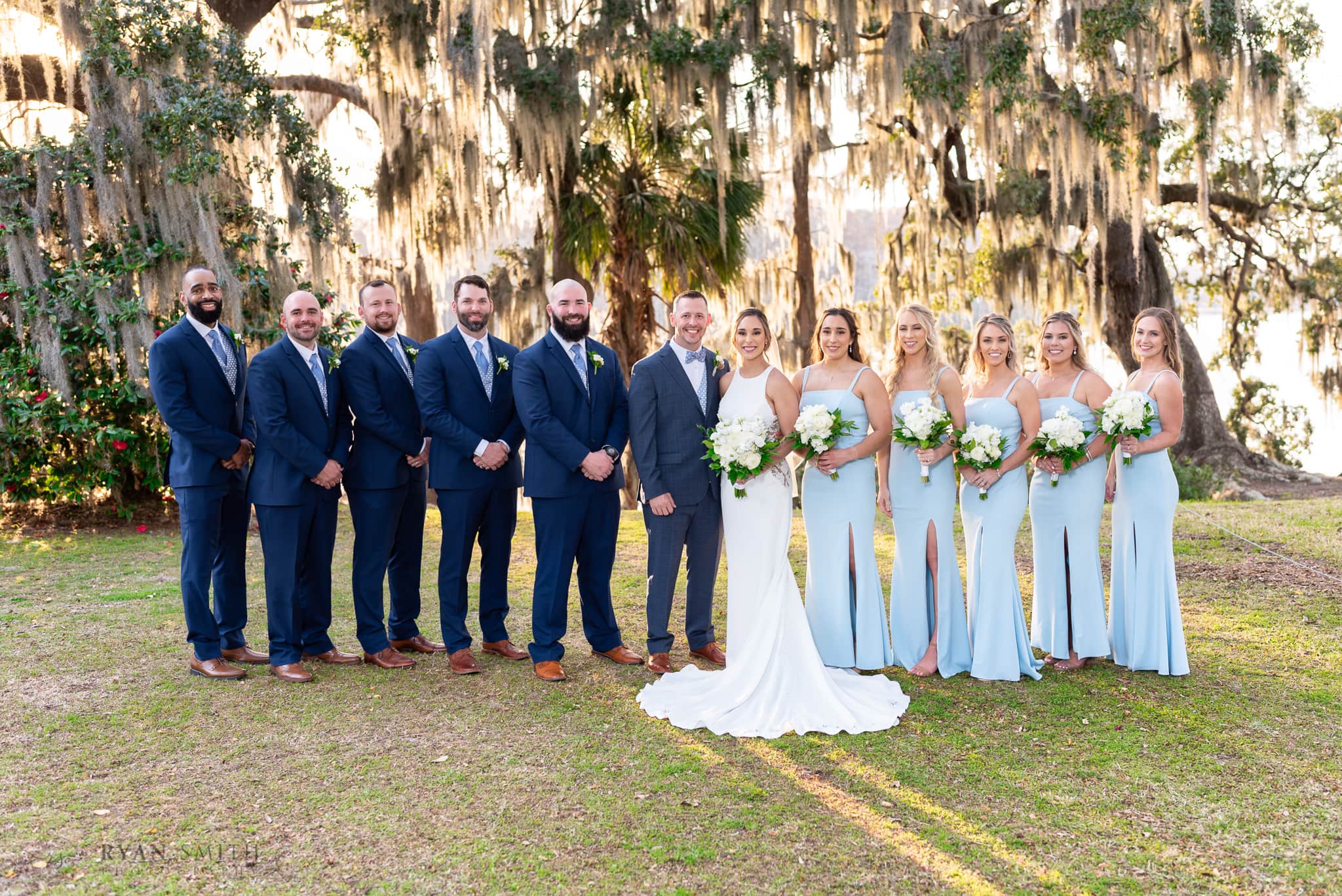 Bridesmaids and groomsmen standing in front the moss - Kimbels at Wachesaw Plantation