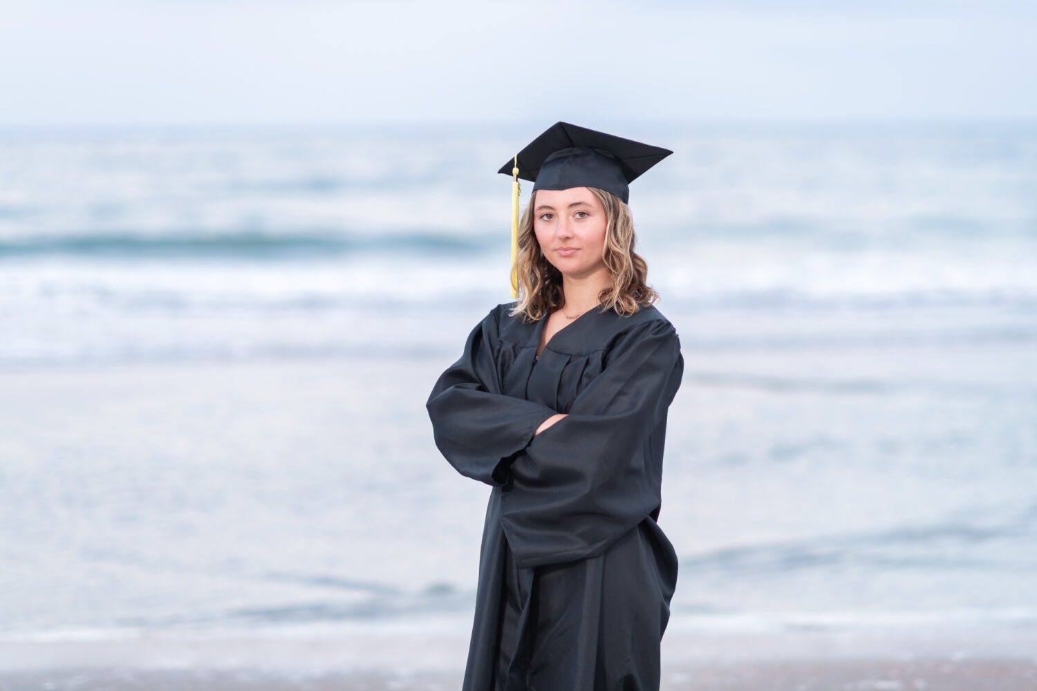 Girl senior portrait with cap and gown - Huntington Beach State Park