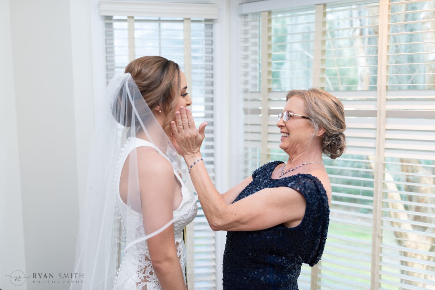 Mom touching bride's face - Kimbels at Wachesaw Plantation