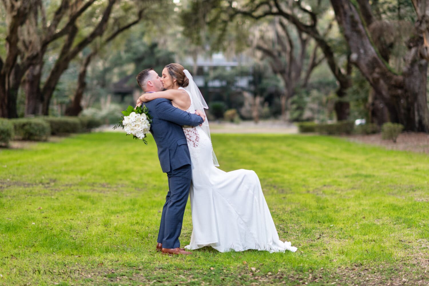 Portraits of the bride and groom on the Oak Allee  - Kimbels at Wachesaw Plantation
