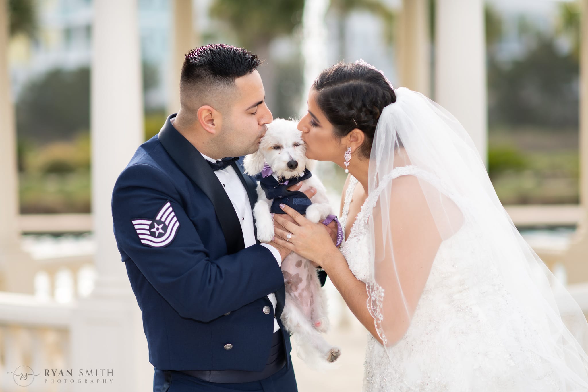Bride and groom kissing their dog on the head - 21 Main Events at North Beach