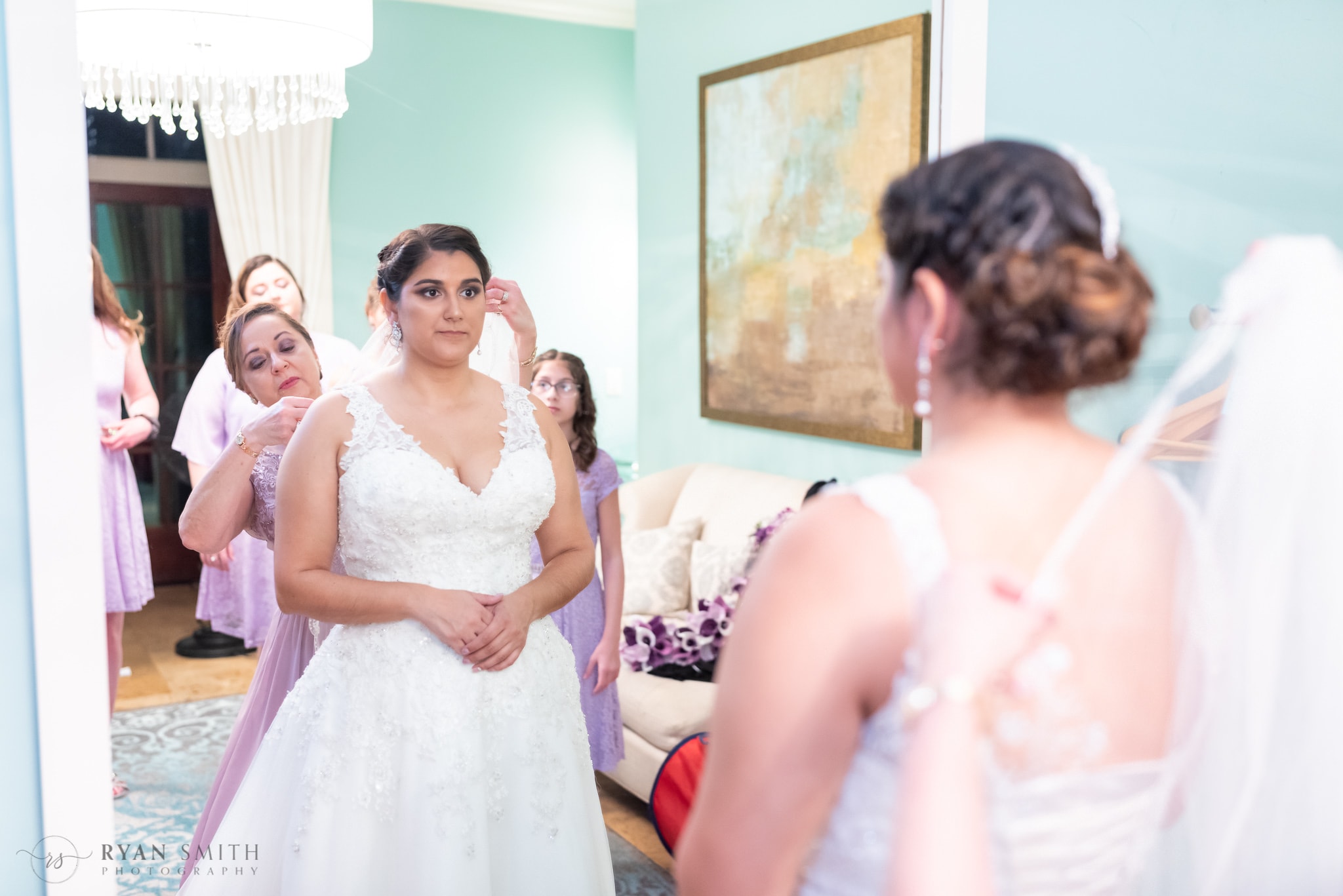 Bride's mother putting on brides veil in mirror - 21 Main Events at North Beach