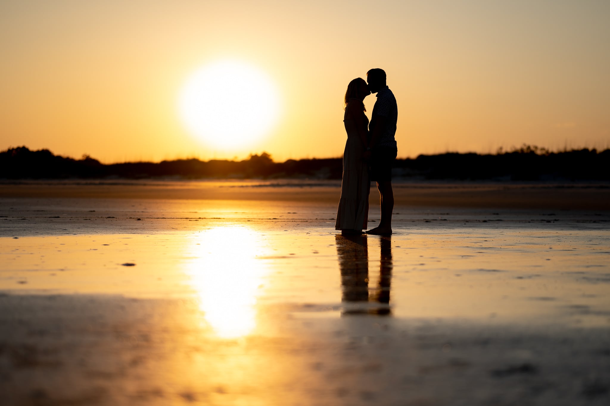 Sunset silhouette with just engaged couple on the beach - Inlet Point Plantation - Little River