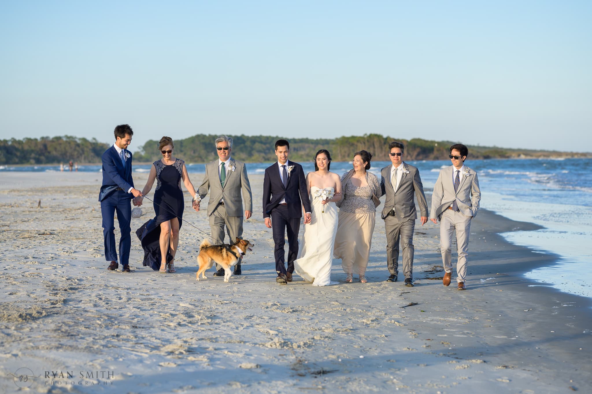 Family walking with bride and groom down the beach - Cherry Grove Point - North Myrtle Beach